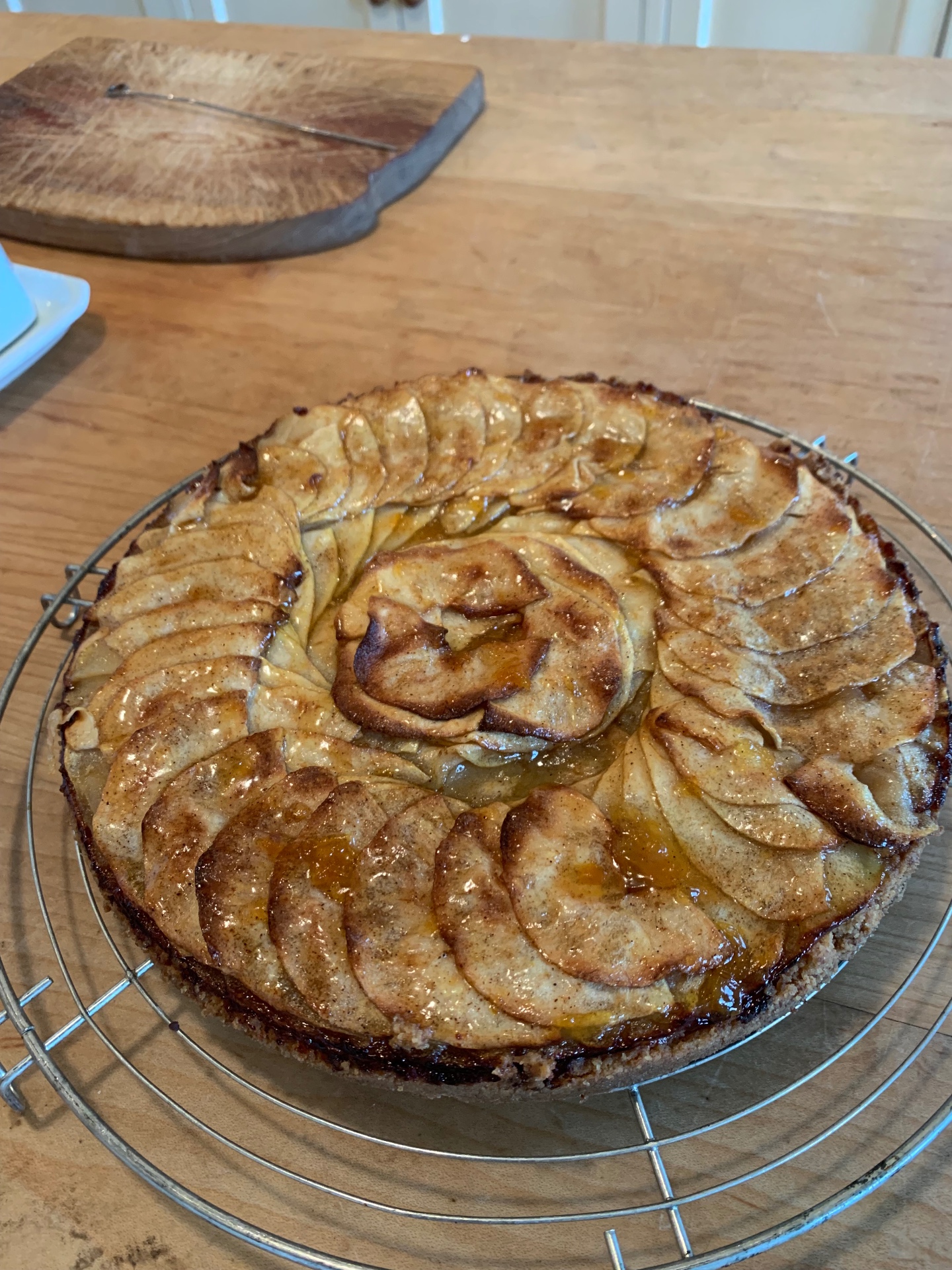 Classic French apple tart (tarte aux pommes) with thinly fan-sliced apples, cinnamon and apricot glaze on buttery shortcrust — a seasonal fruit pastry dessert from a Lovey Chef private dinner in Bristol