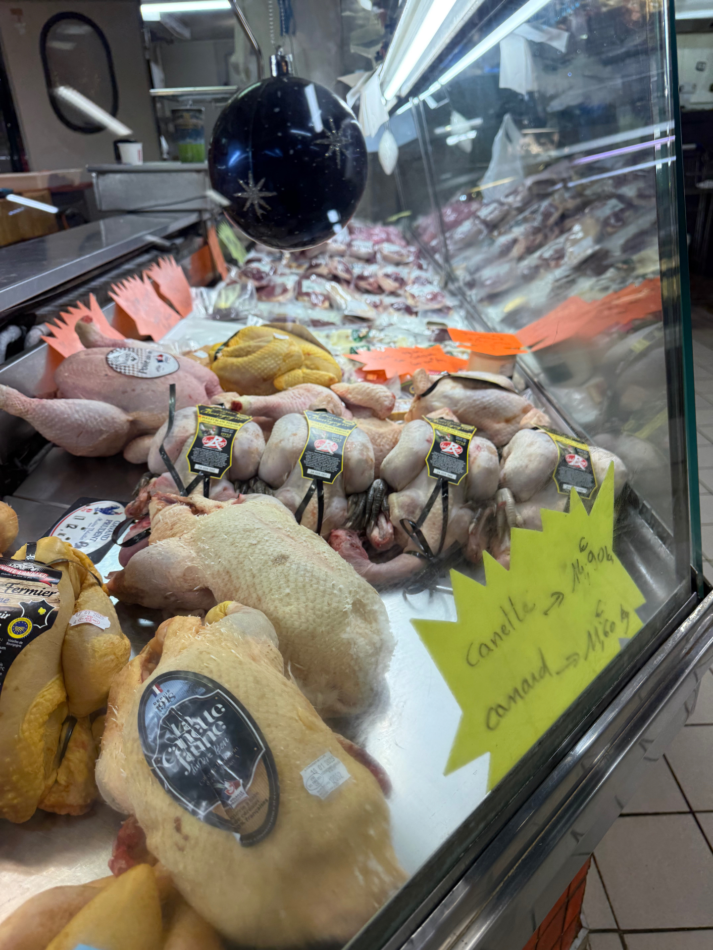 Label Rouge free-range poultry and Bresse chickens at a French butcher's counter